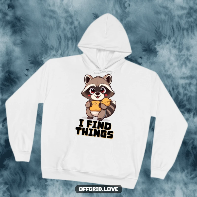 Funny Hoodie: A comical raccoon with wide eyes clutches a found treasure, perfect for cozying up.