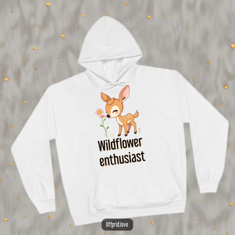 Comfortable hoodie showcasing a curious deer delicately sniffing a beautiful wildflower.